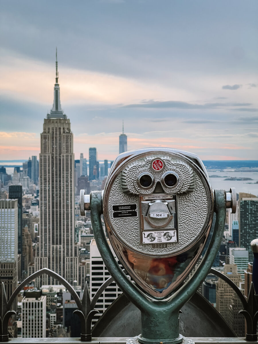 Empire State Building and the Manhattan skyline behind a coin-operated viewer, New York City